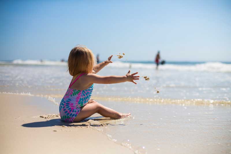 Huskisson-Collingwood-Beach-Baby-Playing in white sand
